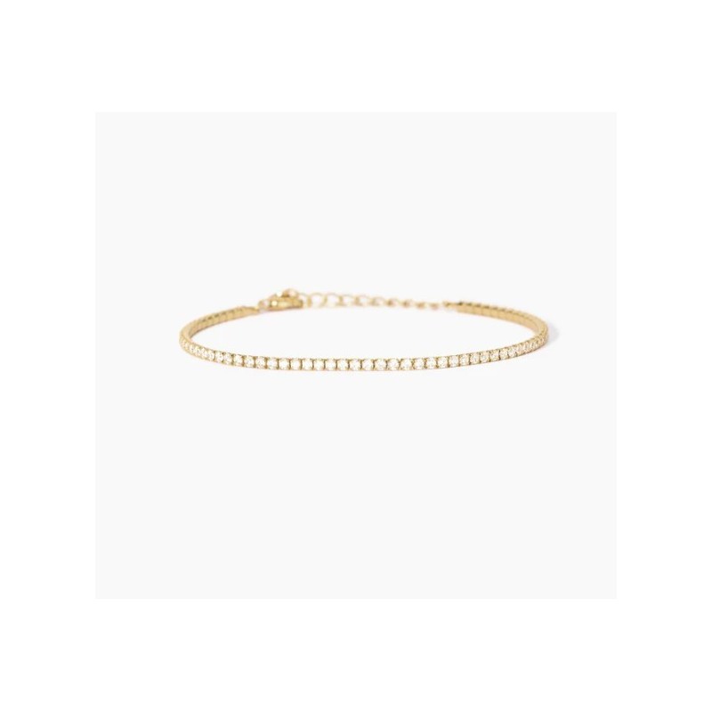 Pulsera fina de tenis en plata chapada en oro con circonitas.