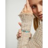 Pulsera de hilo elástico turquesa con corazón bañado en plata de ley